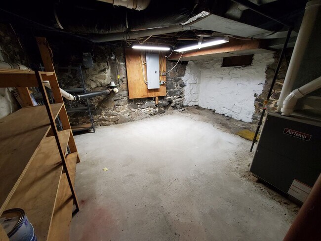 Building Photo - Pet friendly duplex w brand new kitchen & first floor LVP, basement, fenced yard, deck, near comm...