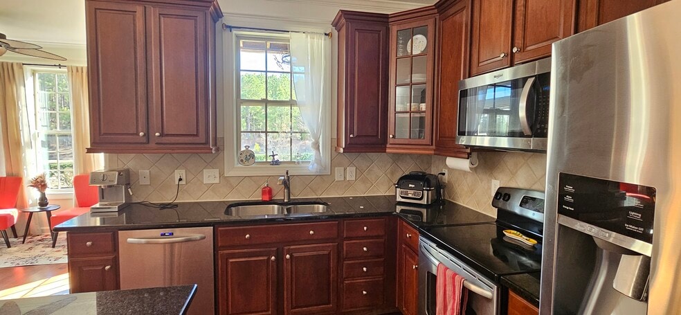Kitchen with window view into balcony and woods - 423 Panorama Park Pl