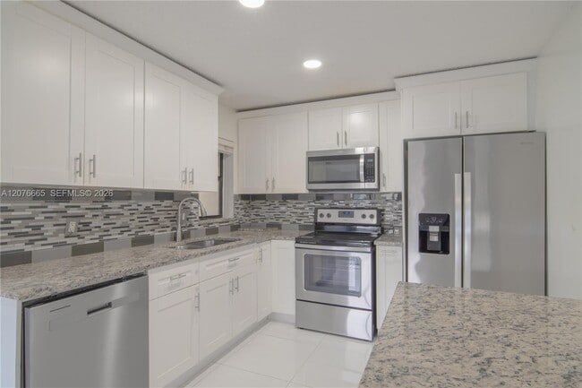 Building Photo - 3745 Cocoplum Cir