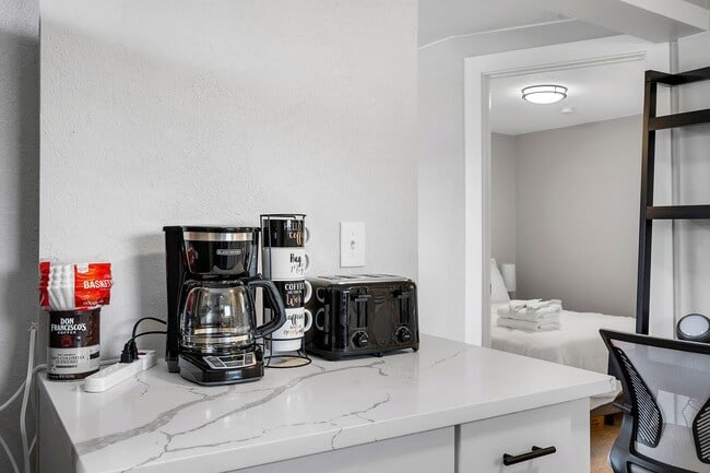 Building Photo - Remodeled and Furnished 1BD, 1BA in the Highlands with Off-Street Parking Spot