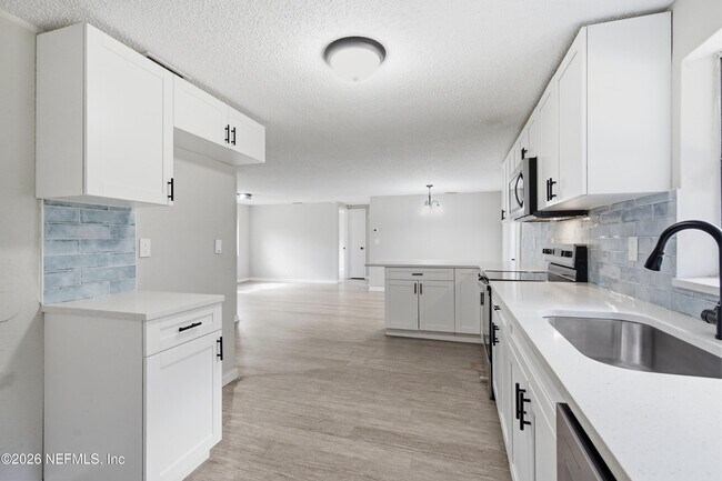 Building Photo - 7386 Dostie Dr E