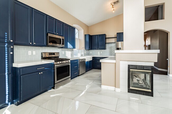 Remodeled kitchen with stainless steel appliances, farmhouse sink, and marble countertops - 8600 Mirada del Sol Dr