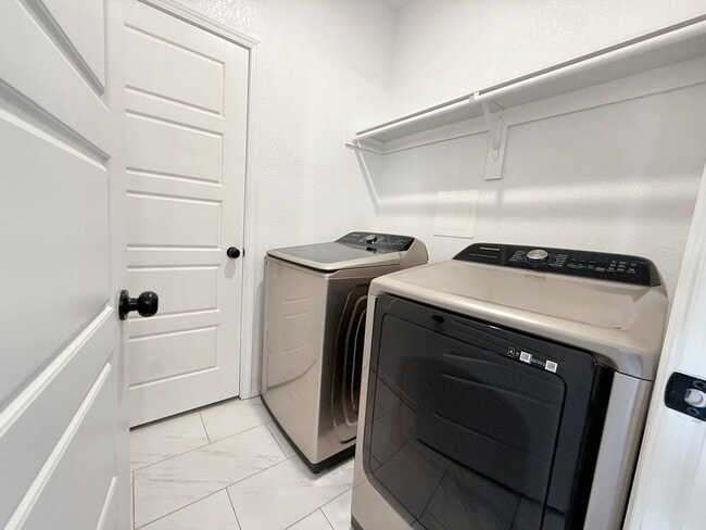 Building Photo - Modern 4-Bedroom Retreat with Patio Deck &...