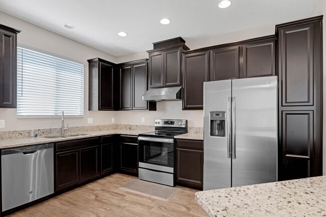 Building Photo - Spacious, Nearly New and Gated 3/2.5/2 Plu...