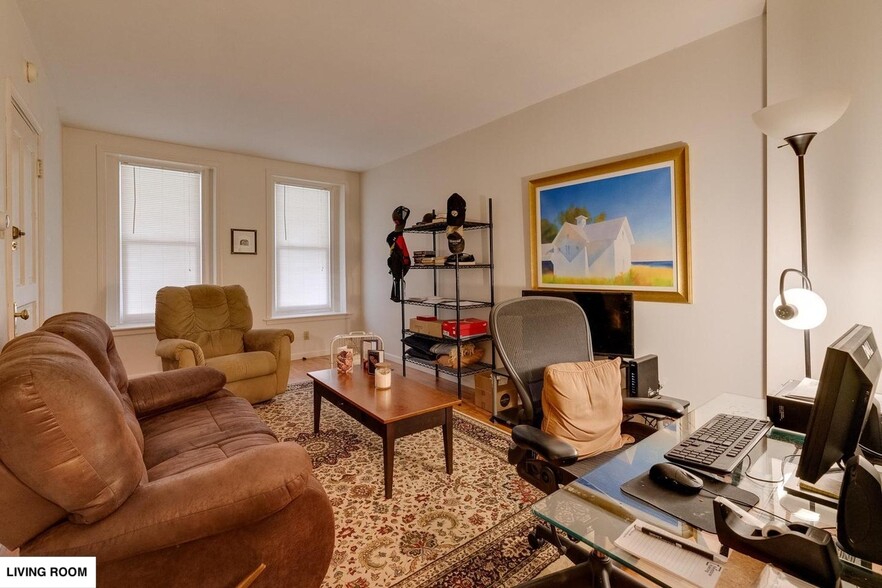 Spacious Living Room with large couches and furniture for scale. - 513 1/2 W James St