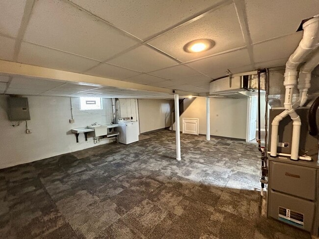 Building Photo - DELHI TWP- Spacious 4 bedroom 3 bath Cape Cod with garage