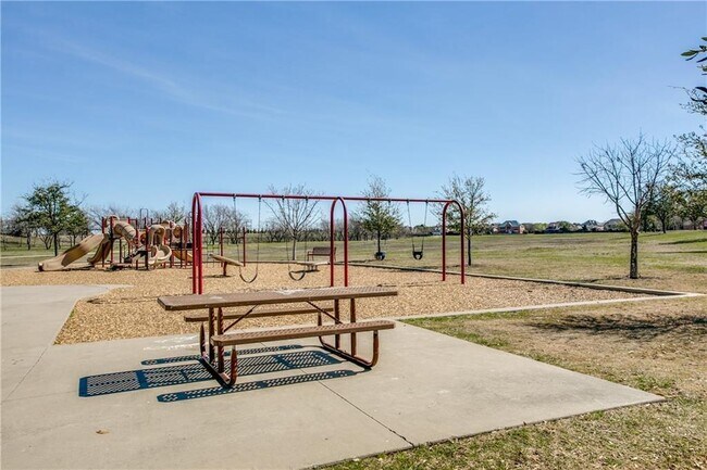 Building Photo - Immaculate home on a beautifully landscaped lot, tandem garage, plenty of storage!