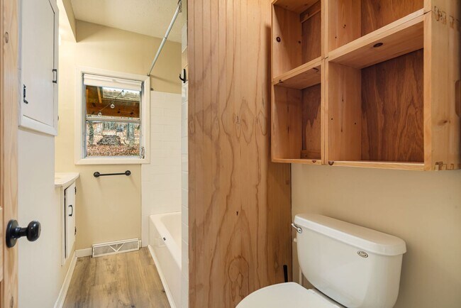 Building Photo - Rural Retreat in Candler with Bonus Room (Heat, Water, & Lawn Maintenance Included)