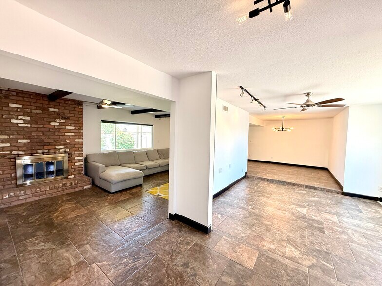 Foyer Entry to Living Room and Family Room with Fireplace. - 2816 E Laurel Ln