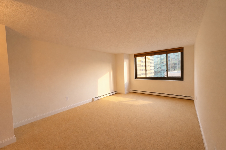 Bright primary bedroom with generous wall space. - 25 Rockledge Ave