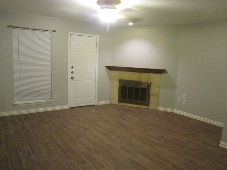 living and fireplace - 239 W Peach St