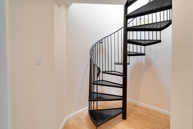 Spiral Interior Stairs connecting two levels, additional stairs not pictured in garage - 1466 14th Ave