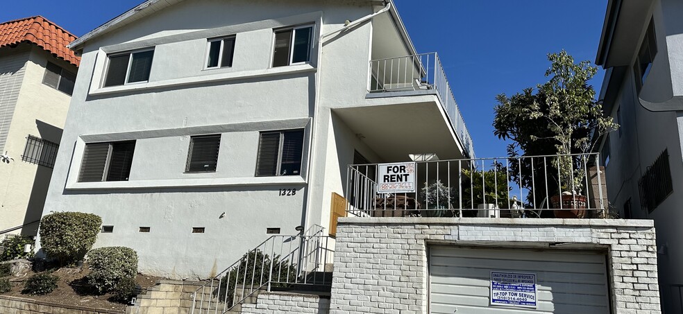 Front of building, 2-bedroom apartment above front - 1328 Barry Ave