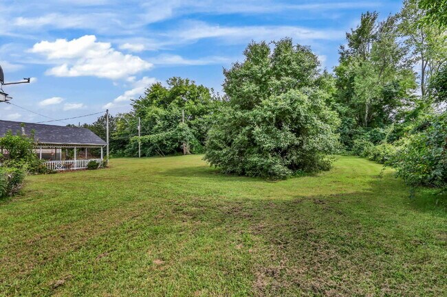 Building Photo - spacious 4-bedroom, 2.5-bath home featuring a 2-car garage and fresh updates throughout.