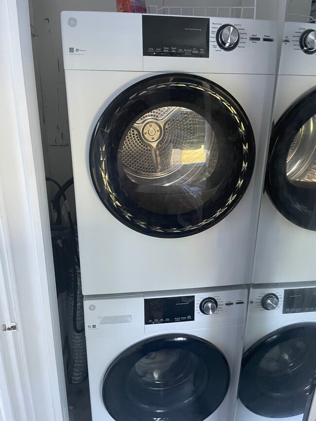 Main Level stackable laundry in mirrored closet - 38 Ferry Ln E