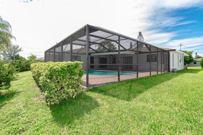 Building Photo - Gulf Access Pool Home. 4BED/2BATH. SE OF CAPE CORAL FL. Special Offer! Qualify for a deposit-free...