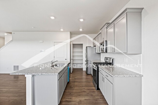 Building Photo - Modern 4-Bed, 2.5-Bath Home with 2 car garage, AC and Private Enclosed Yard