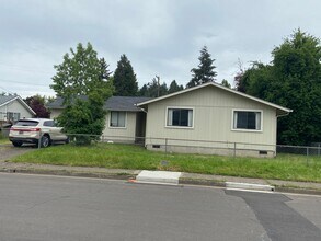 Building Photo - New Paint & Flooring. Large yard and over...