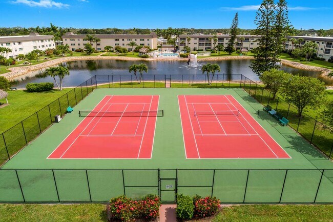 Building Photo - AVAILABLE NOW! Furnished Ground-Floor End Unit | Lake & Pool Views | Minutes to Marco Island & Do...