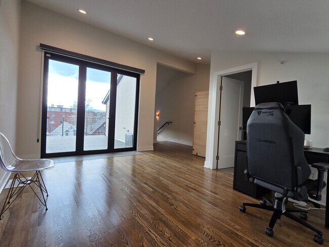 Building Photo - STUNNING 4-LEVEL TOWNHOME IN HIGHLANDS WITH SAUNA, 2-CAR GARAGE + AMAZING ROOFTOP DECK!