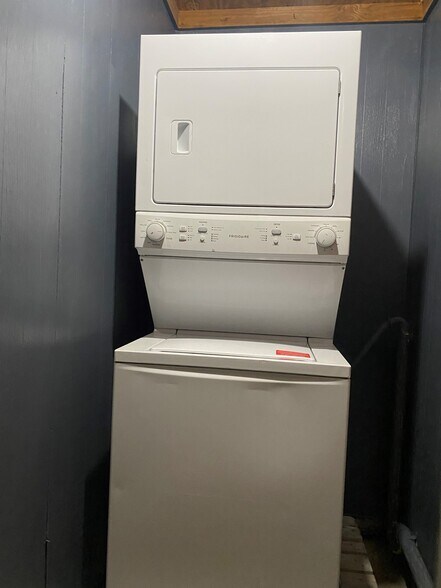 Full-size stackable washer/dryer located in closet accessible from back porch (not heated or cooled) - 2101 Palmore Rd