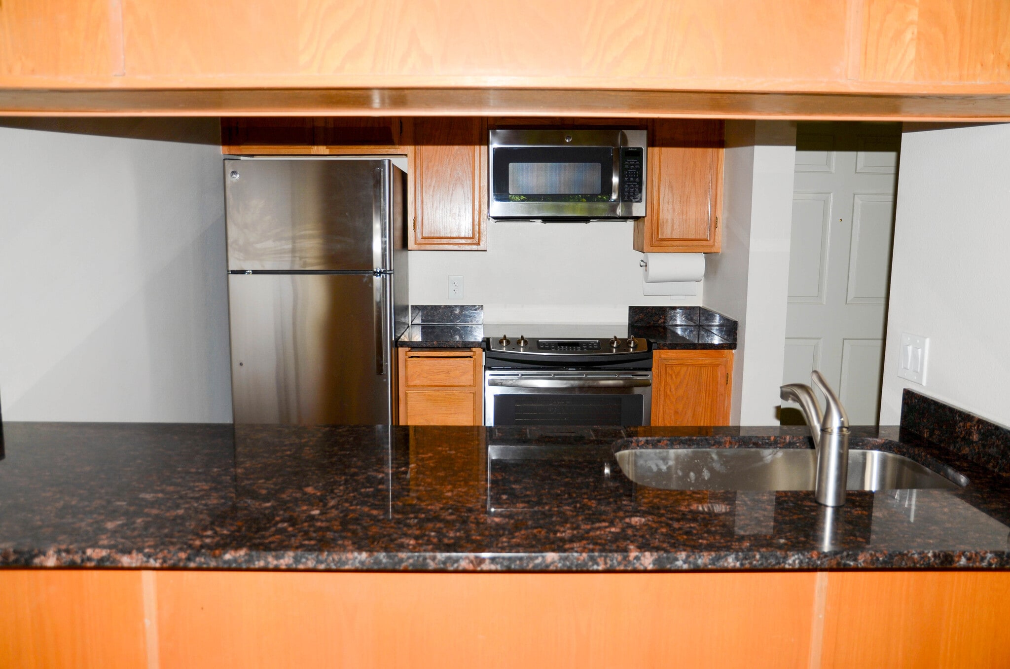 Kitchen As Seen From Living Room - 10501 8th Ave NE