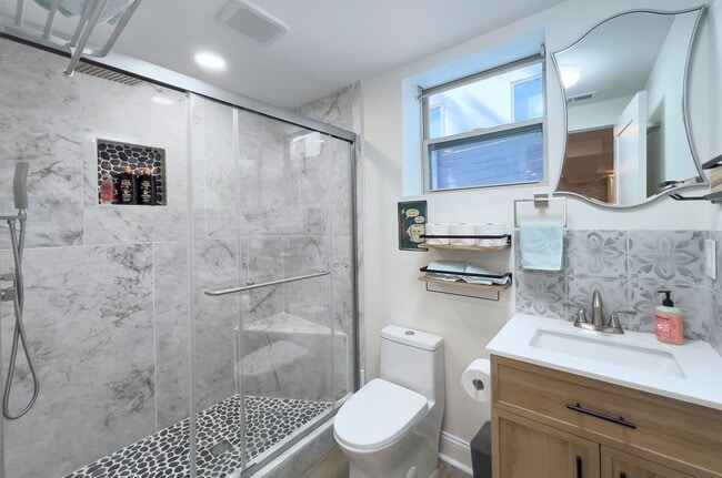Building Photo - Discover the charm of this FULLY FURNISHED basement unit, tucked away in a beautifully updated bu...