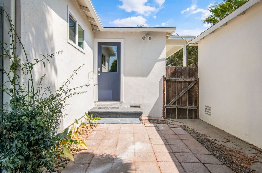 View of door leading from kitchen- Gated private backyard - 9211 Earl St