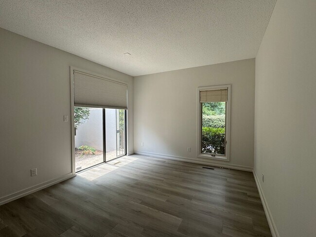 Building Photo - Spacious 2-Story Falconbridge Condo with Private Courtyard and Resort-Style Amenities