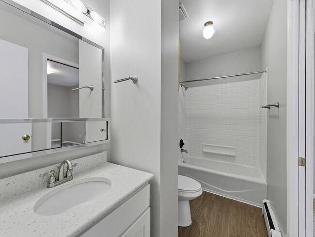 Building Photo - Spacious 2 Bed Condo W/ Bonus Basement Room, Fireplace & Garage Available NOW!