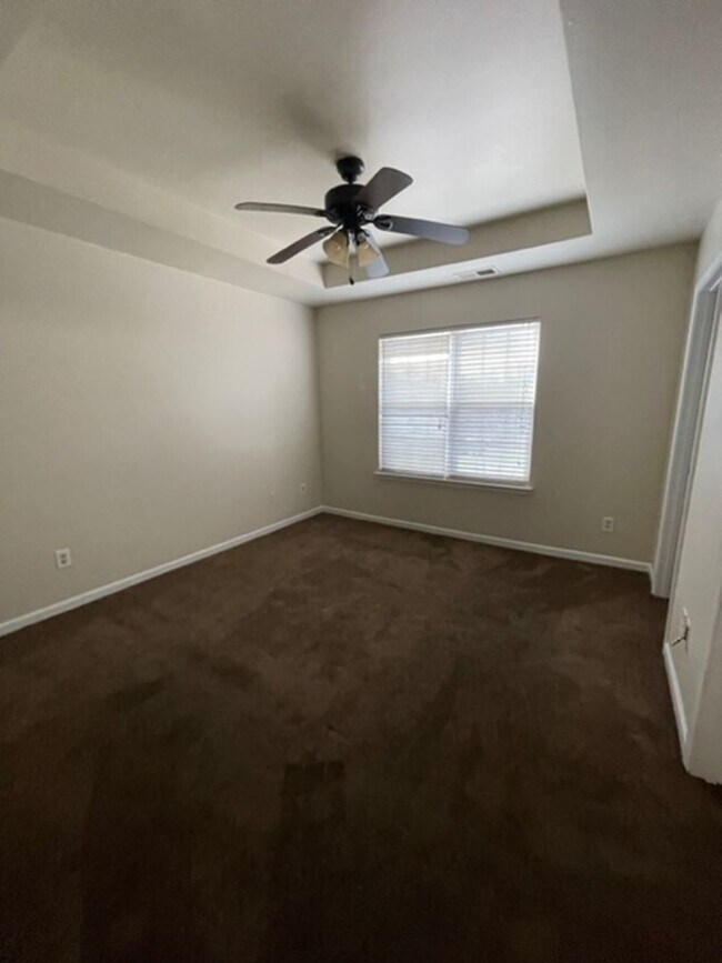 Building Photo - Must see this 4 bedroom 2.5 bath townhouse with 1 car garage .