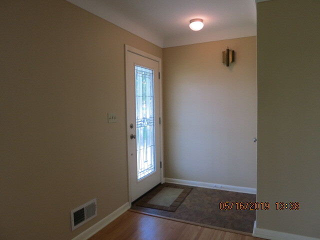 Front door entryway. Coat closet when walk in. Living room to right. - 930 W County Rd D