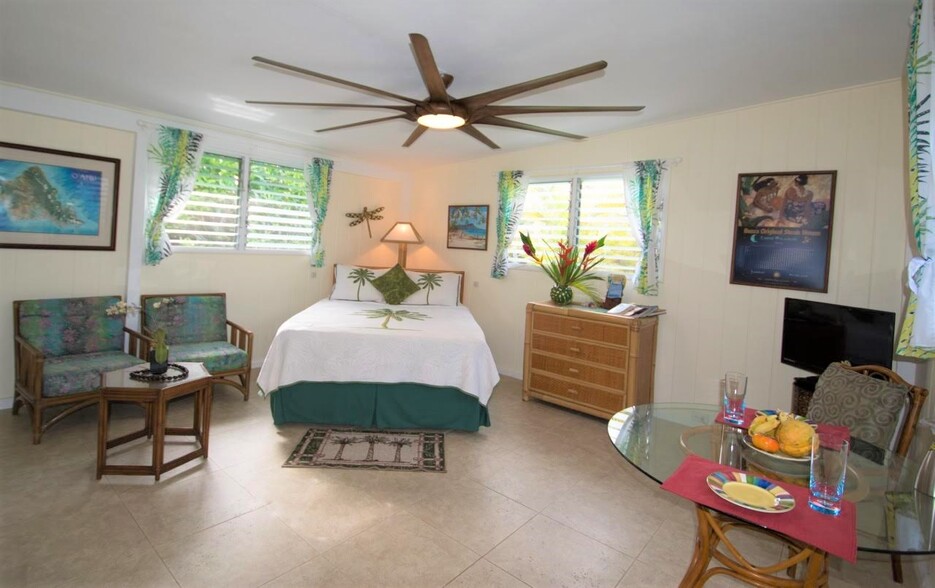 Bedroom surrounded by Lush Gardens - 291 Awakea Rd