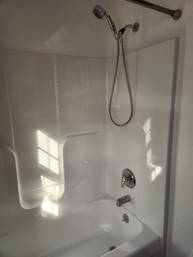 Refinished shower and tub. - 6568 Ward Rd