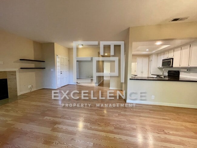 Building Photo - 2/2 Condo with 1 Car Garage, Wrap Around Patio, Fireplace, Granite Kitchen and Community Pool
