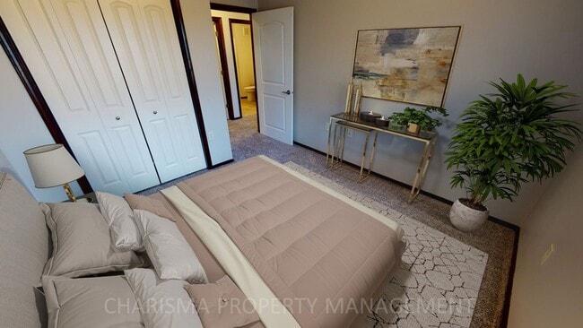 Building Photo - LOWER LEVEL 3 BEDROOM, 2 BATH TOWN HOME, INDIVIDUAL ENTRANCE, DOUBLE ATTACHED GARAGE, PET FRIENDLY