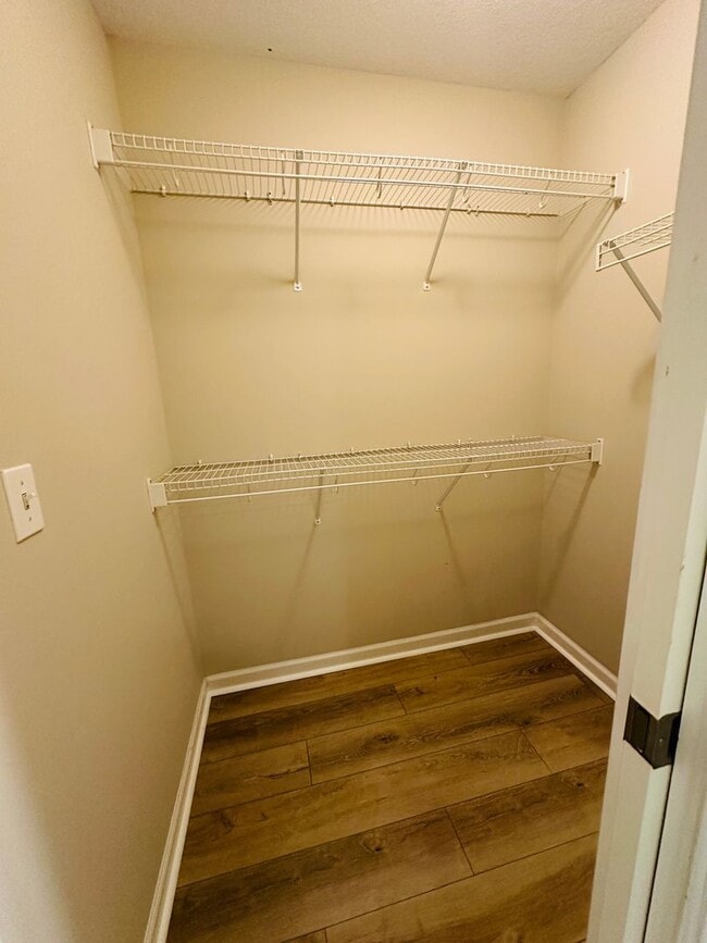 Building Photo - 2 bed, 2.5 bath updated townhouse w/ 1-car garage & Trex deck available now