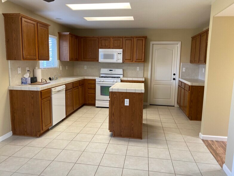 Includes a refrigerator. - 11018 Sonoma Creek Ct