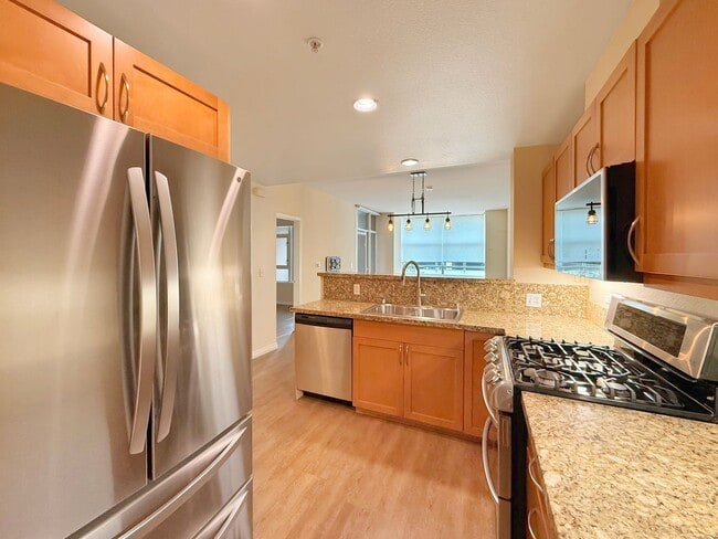 Building Photo - Newly Remodeled 2B/2BA condo w/ Reserved P...