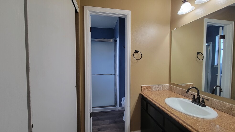 View of primary sink and into the bathroom. - 513 Southpark Rd