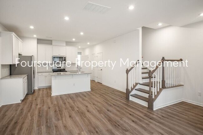 Building Photo - Spacious 3-Bed / 2.5-Bath Townhome with First-Floor Den, Hardwood Floors & 1-Car Garage – Wendell...