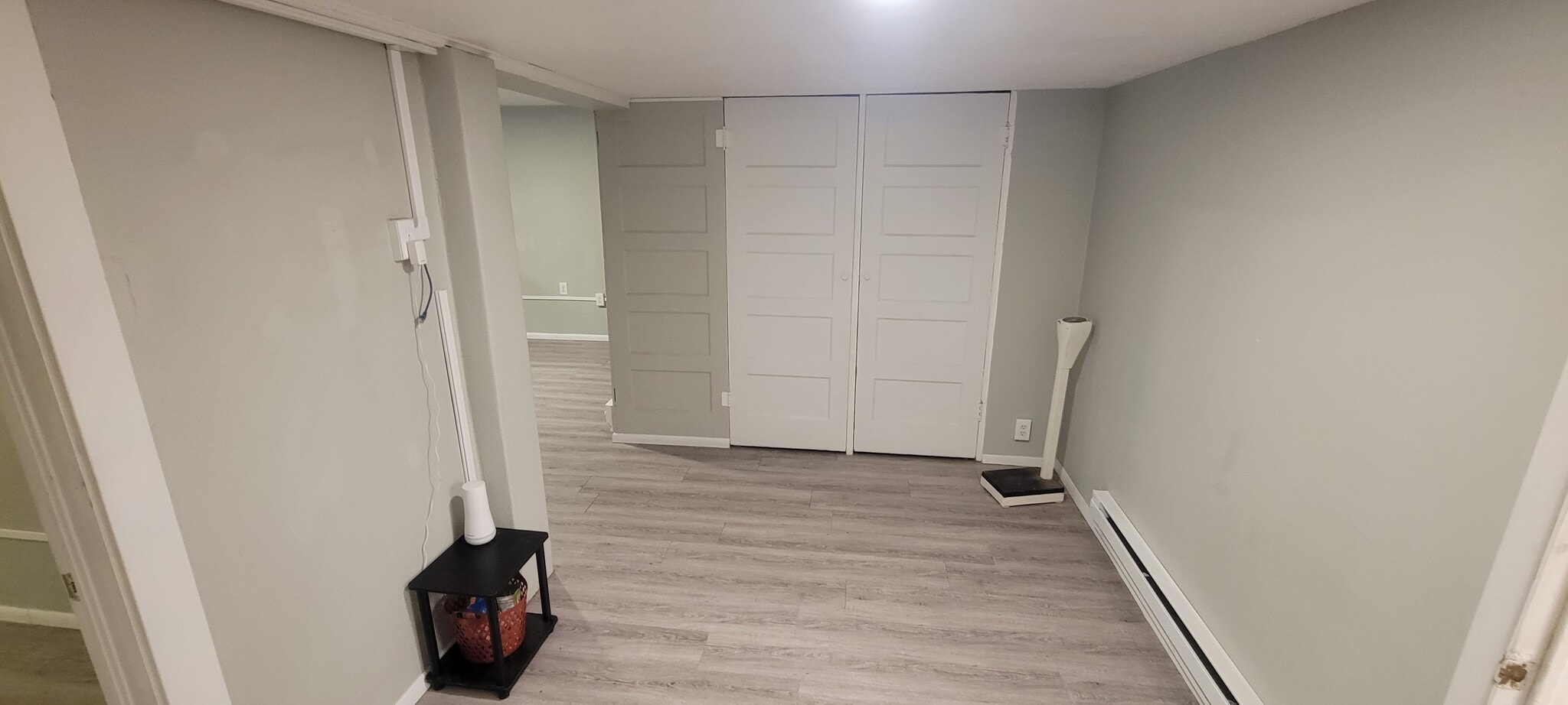 From near bottom-of-stairs looking towards (to the left) a very spacious living/movie/workout room t - 814 Atchison Ave