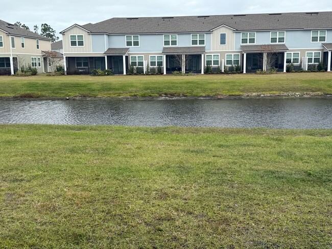 Building Photo - Serene Pond-View Townhouse in Palm Coast: ...