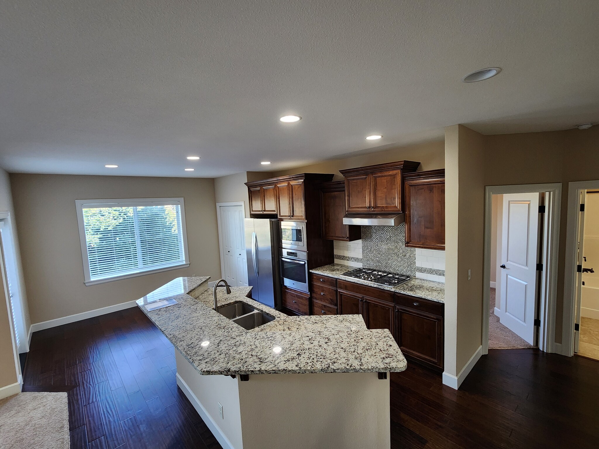 Breakfast Nook, Kitchen Space, Bedroom, and Full Bathroom - 6128 NW Trowbridge Dr