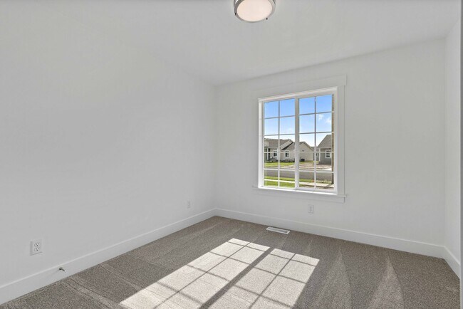 Building Photo - NEW HOME with large garage stalls and unfinished basement for additional storage