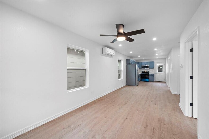 Open spaces featuring the leaving room and a mini dining room area. - 2312 Lucinda St
