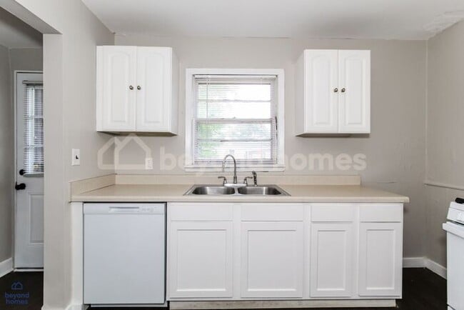 Building Photo - Updated Bungalow with Massive Deck and Fully Fenced Yard!
