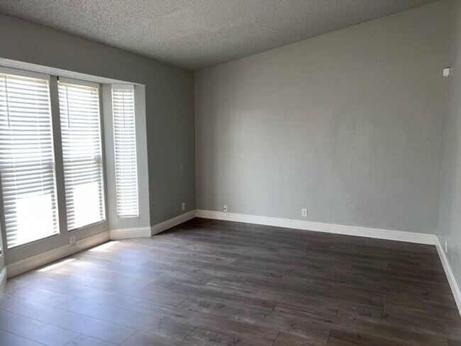 Building Photo - Laminate flooring throughout. Solar panels...
