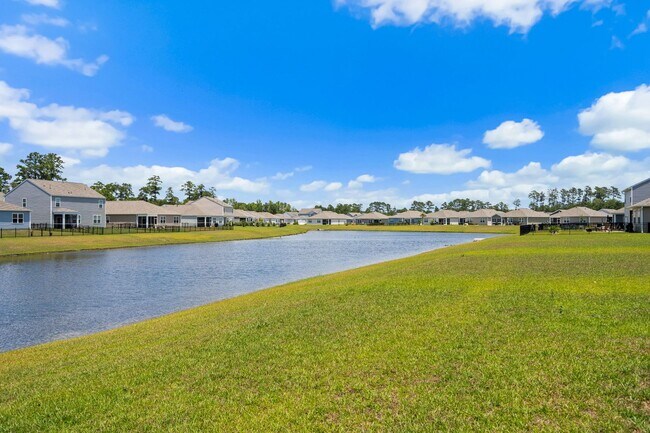 Building Photo - Modern 4BR Home with Screened Porch & Pond Views | Sun Colony, Longs SC