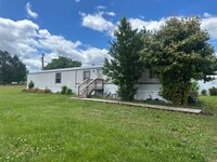 Building Photo - Single wide located in the country. Lots o...